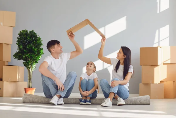 Happy family receiving keys to new home